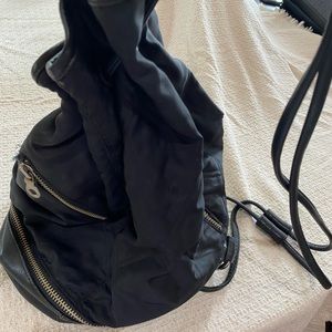 Andrew Marc of NY bucket style shoulder backpack type bag. Leather bottom.